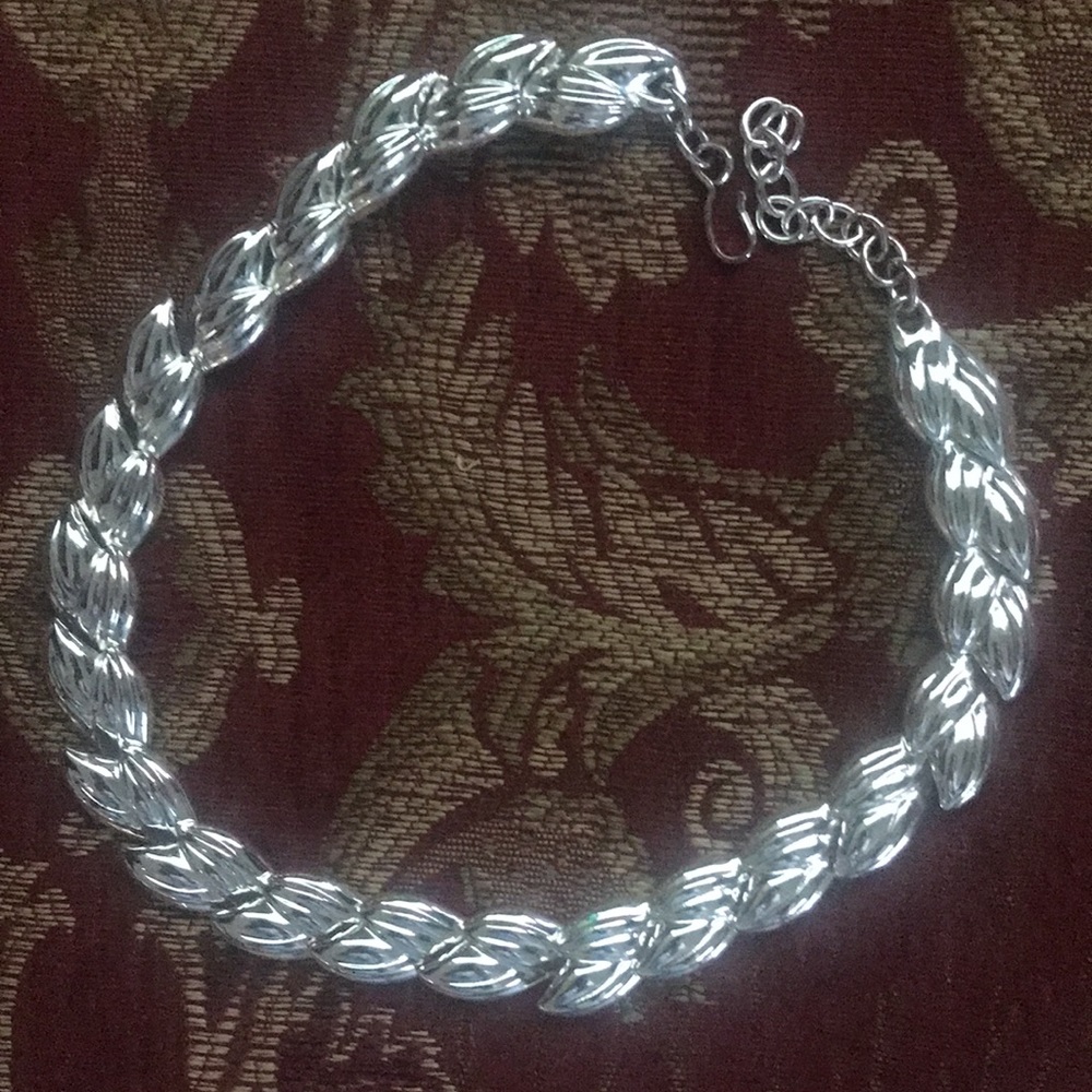 Monet silver leaves collar necklace.